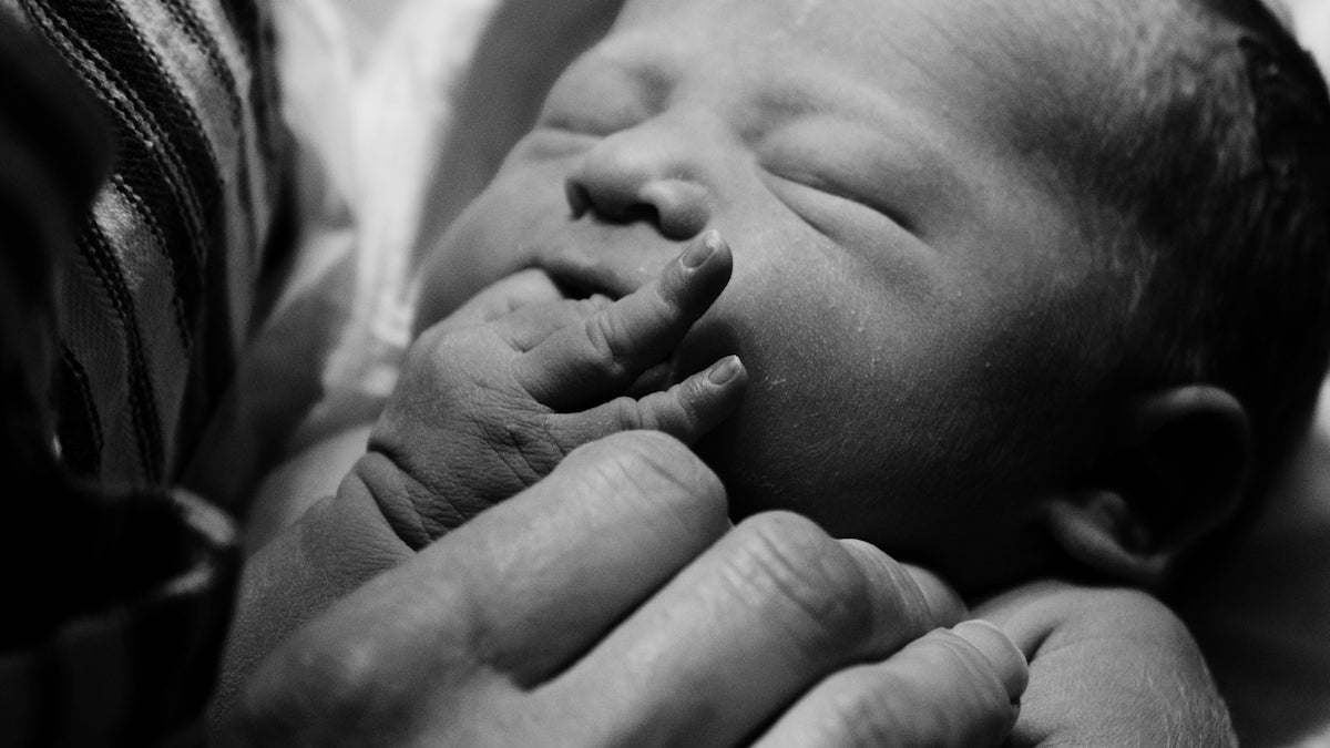 a person holding a baby