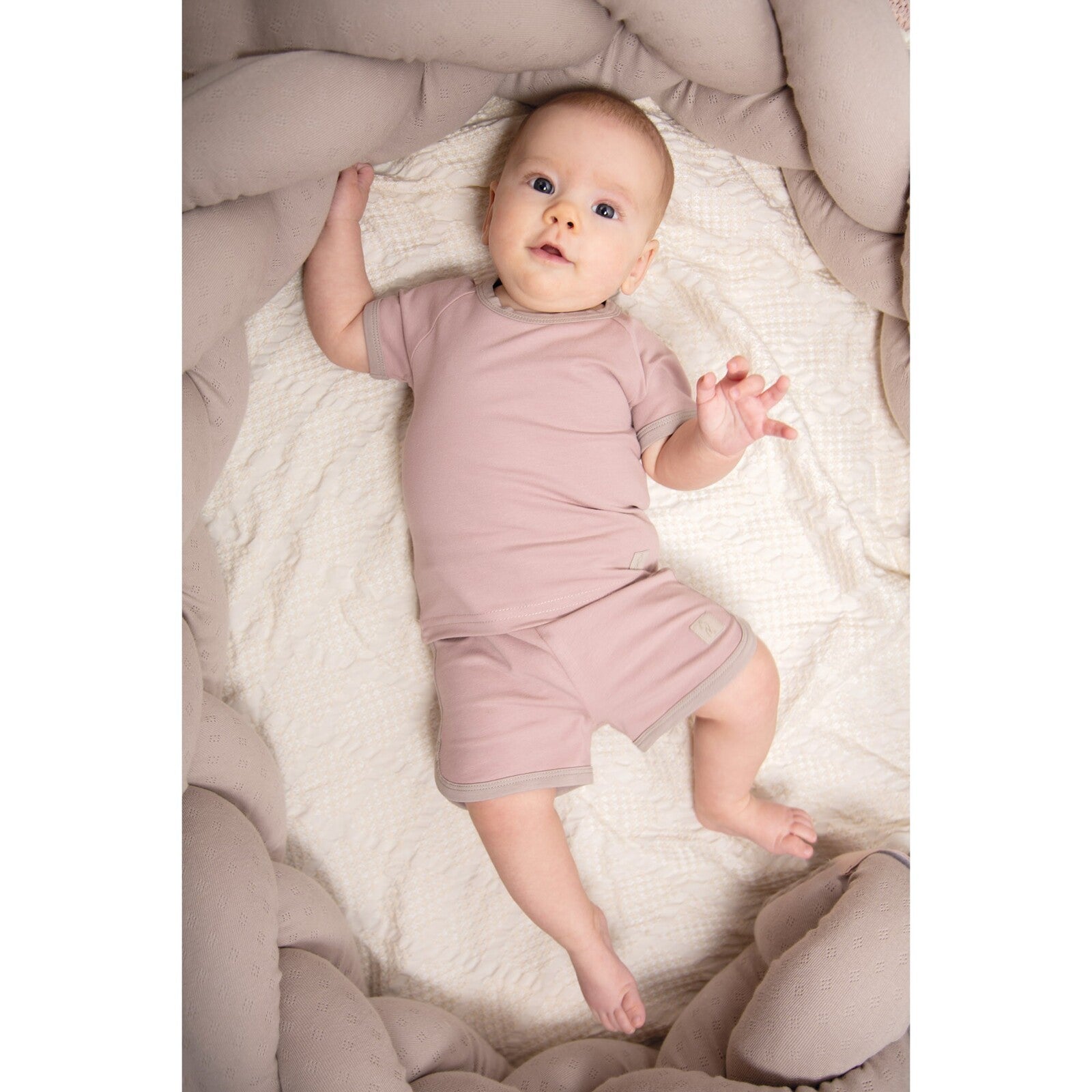 Treccia in cotone organico, riduttore per culla