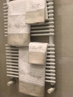 Asciugamani in apone con fascia in lino