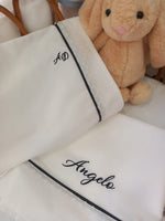 Lenzuolino con profilo e fascia di plumetis