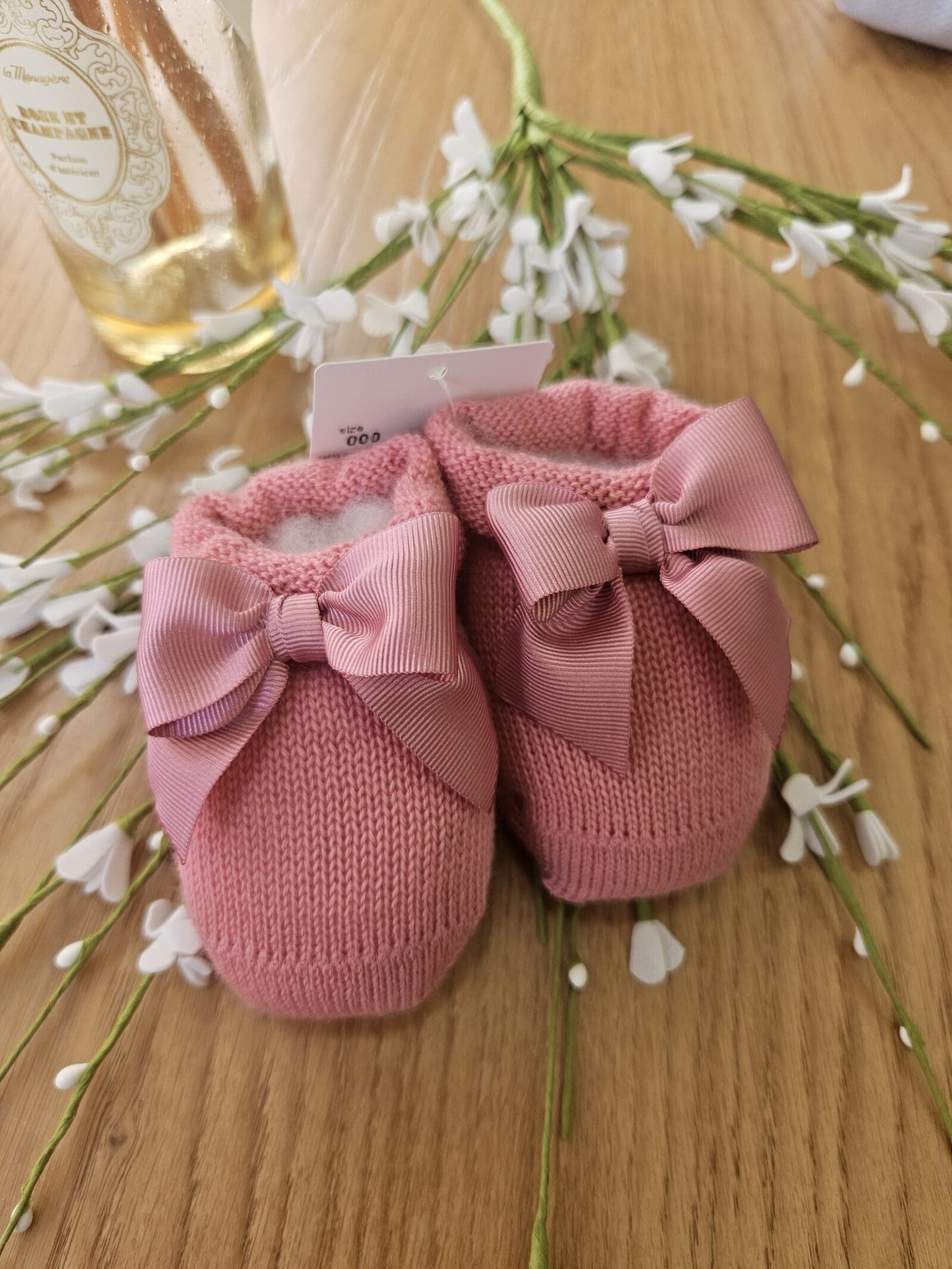 Scarpine neonato in lana con fiocco in gros grain