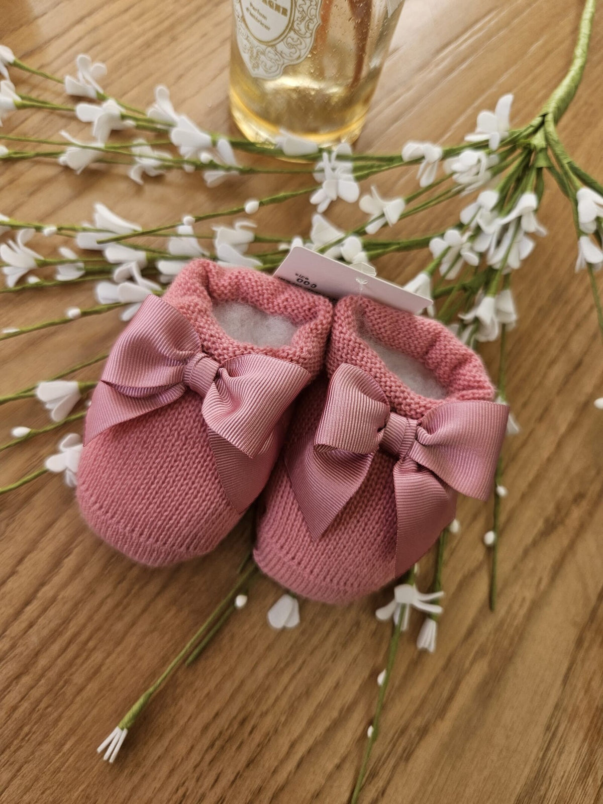 Scarpine neonato in lana con fiocco in gros grain