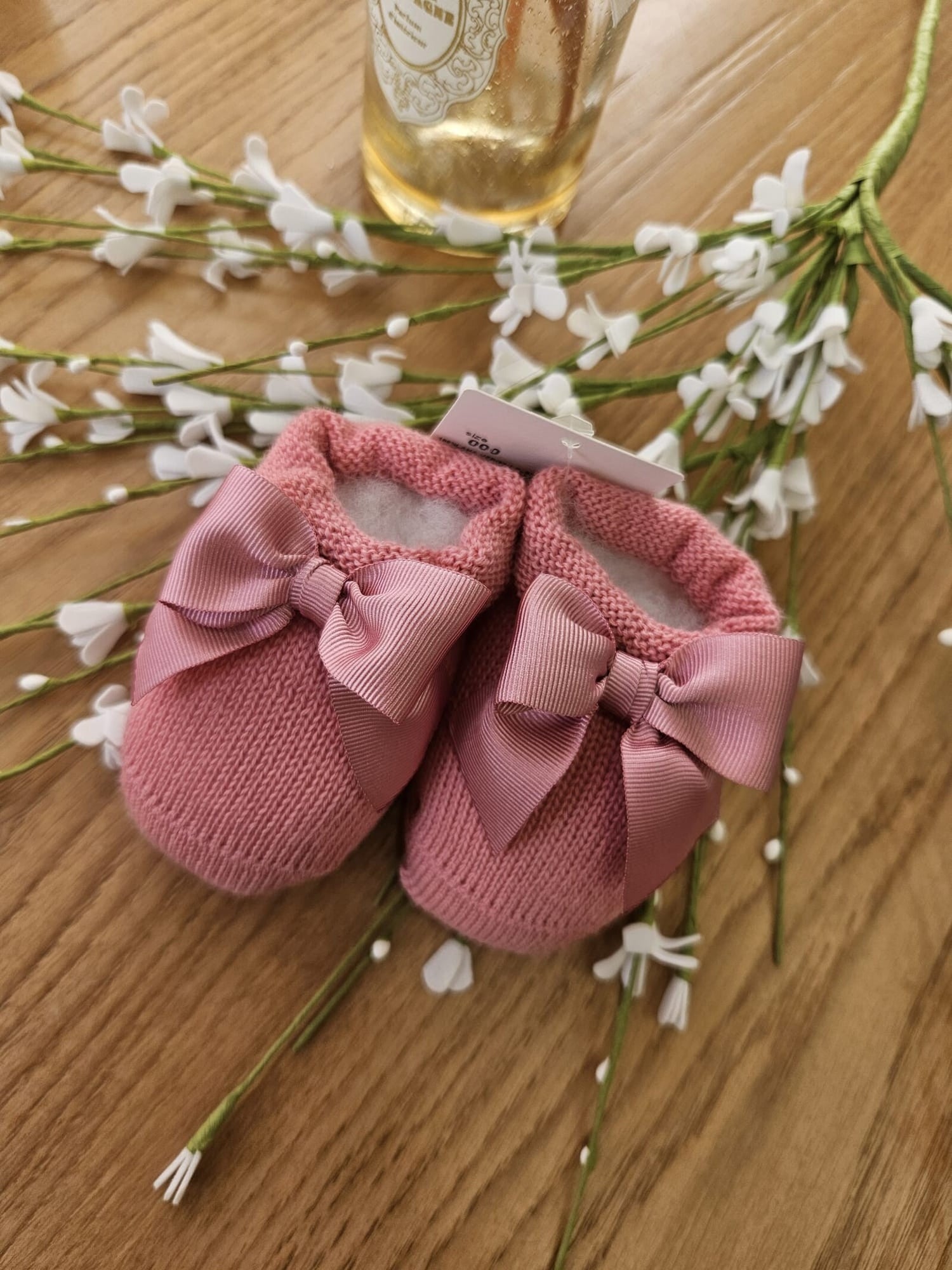 Scarpine neonato in lana con fiocco in gros grain