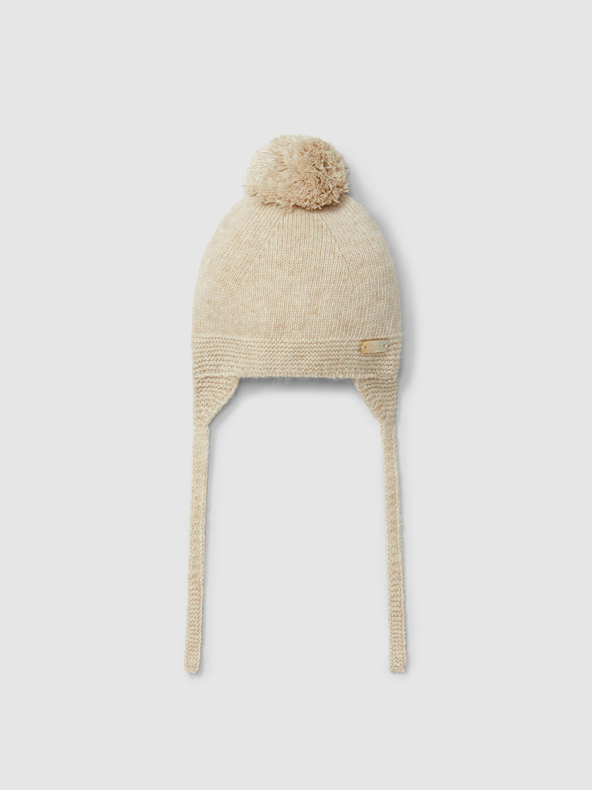 Berretto lavorato a maglia con pon pon