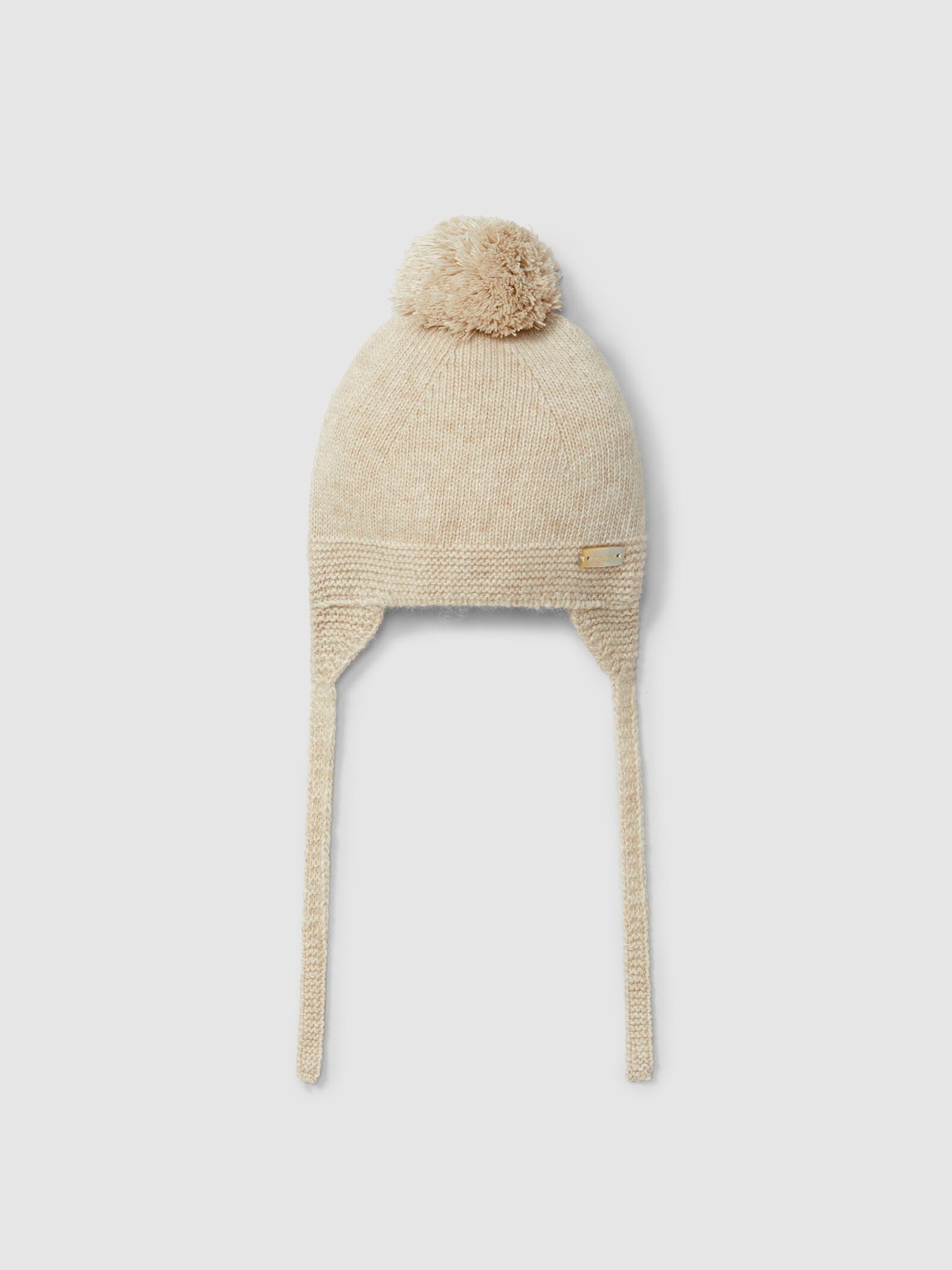 Berretto lavorato a maglia con pon pon