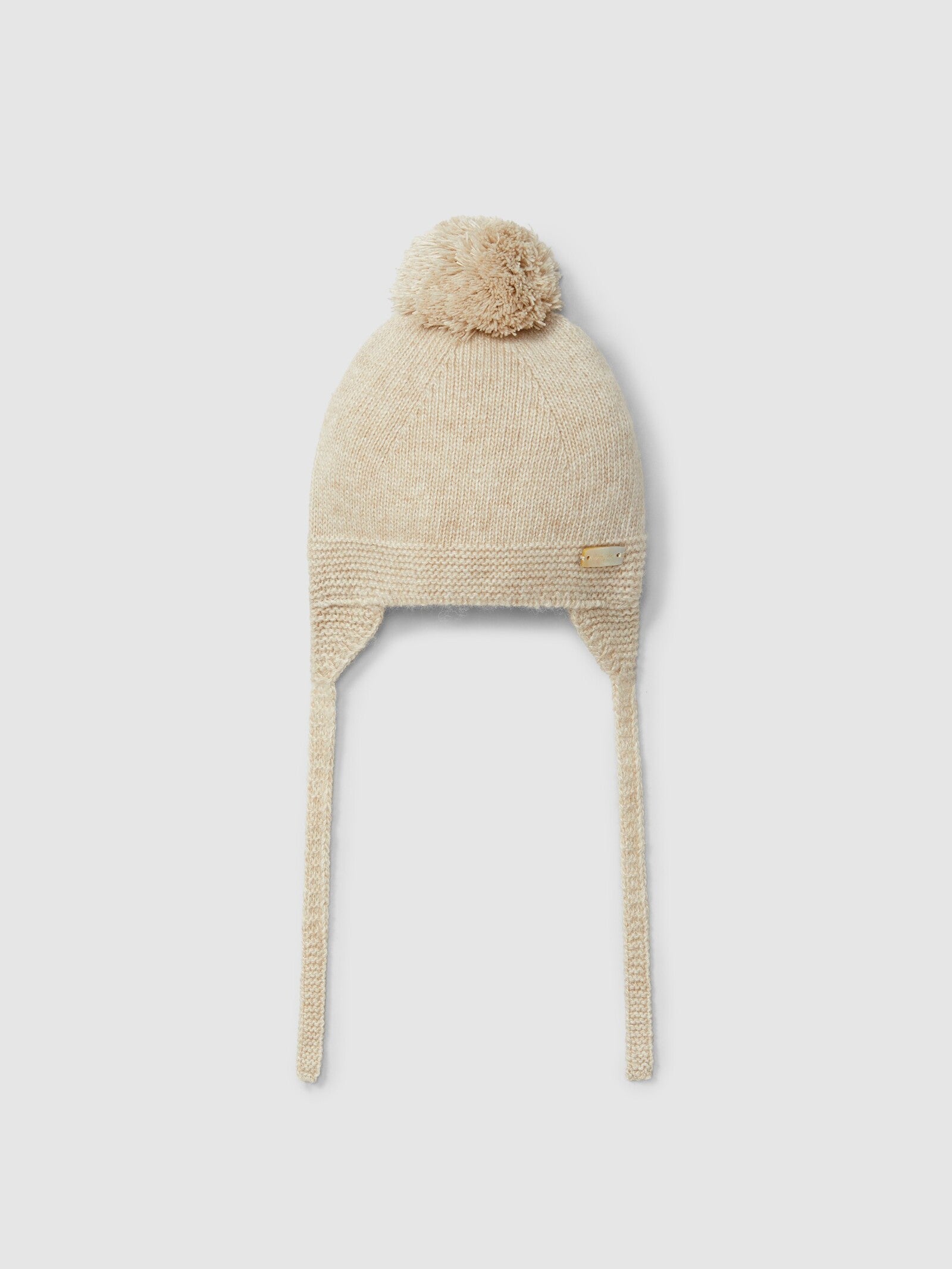 Berretto lavorato a maglia con pon pon