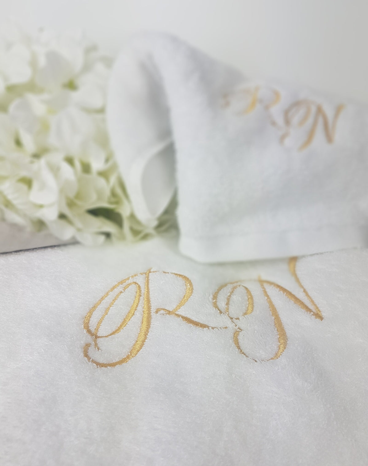 Coppia di asciugamani in spugna di cotone bianca