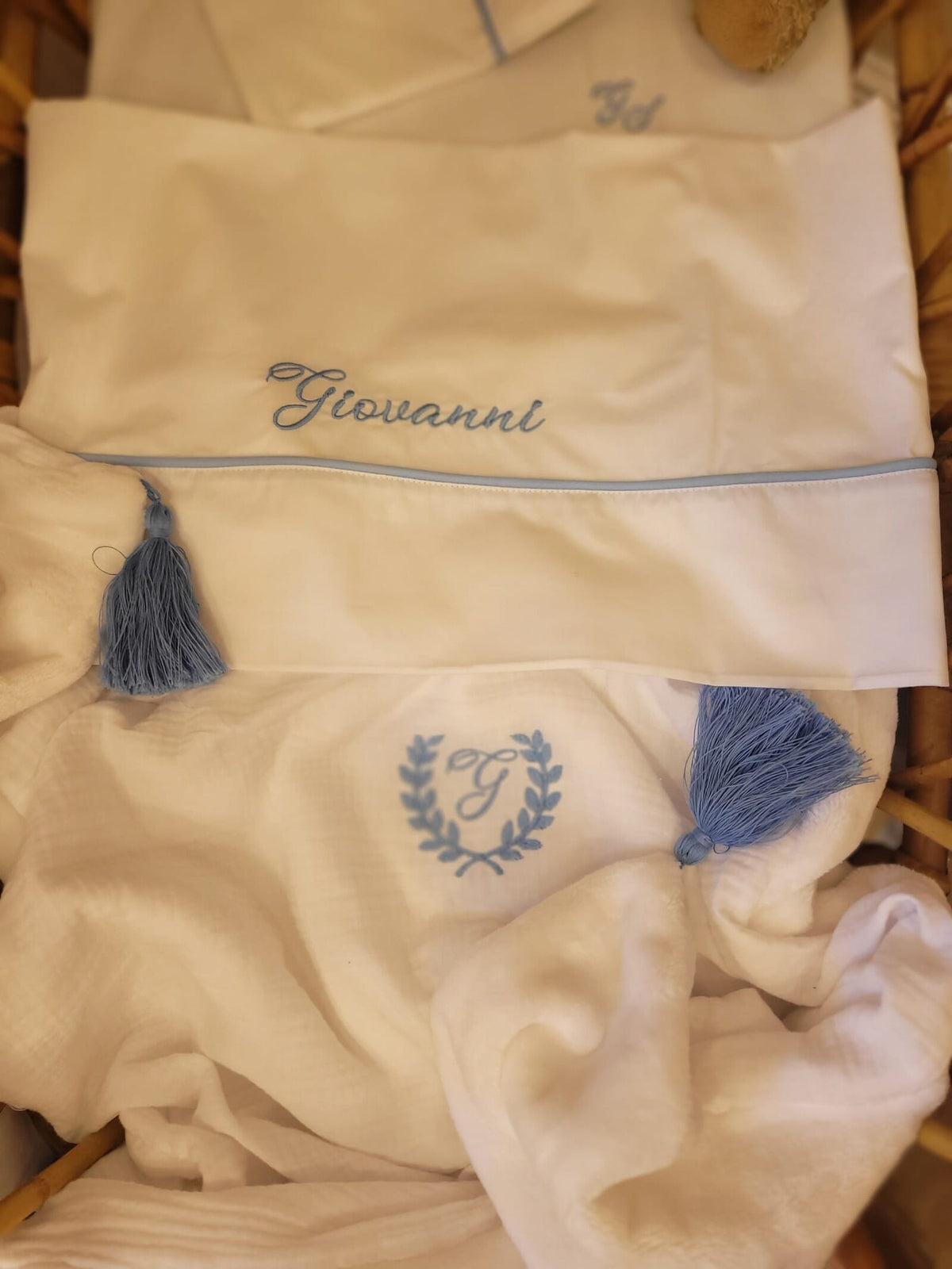 Copertina mussola e pile con nappe in merino