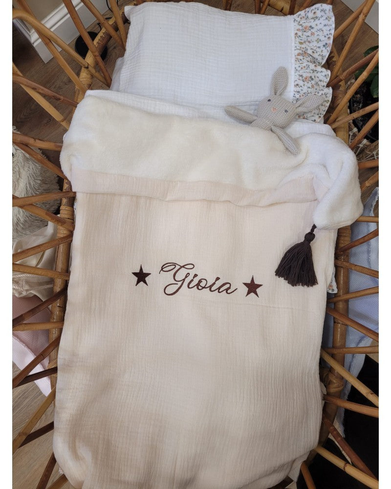 Copertina mussola e pile con nappe in merino