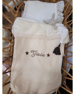 Copertina mussola e pile con nappe in merino