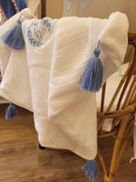 Copertina mussola e pile con nappe in merino